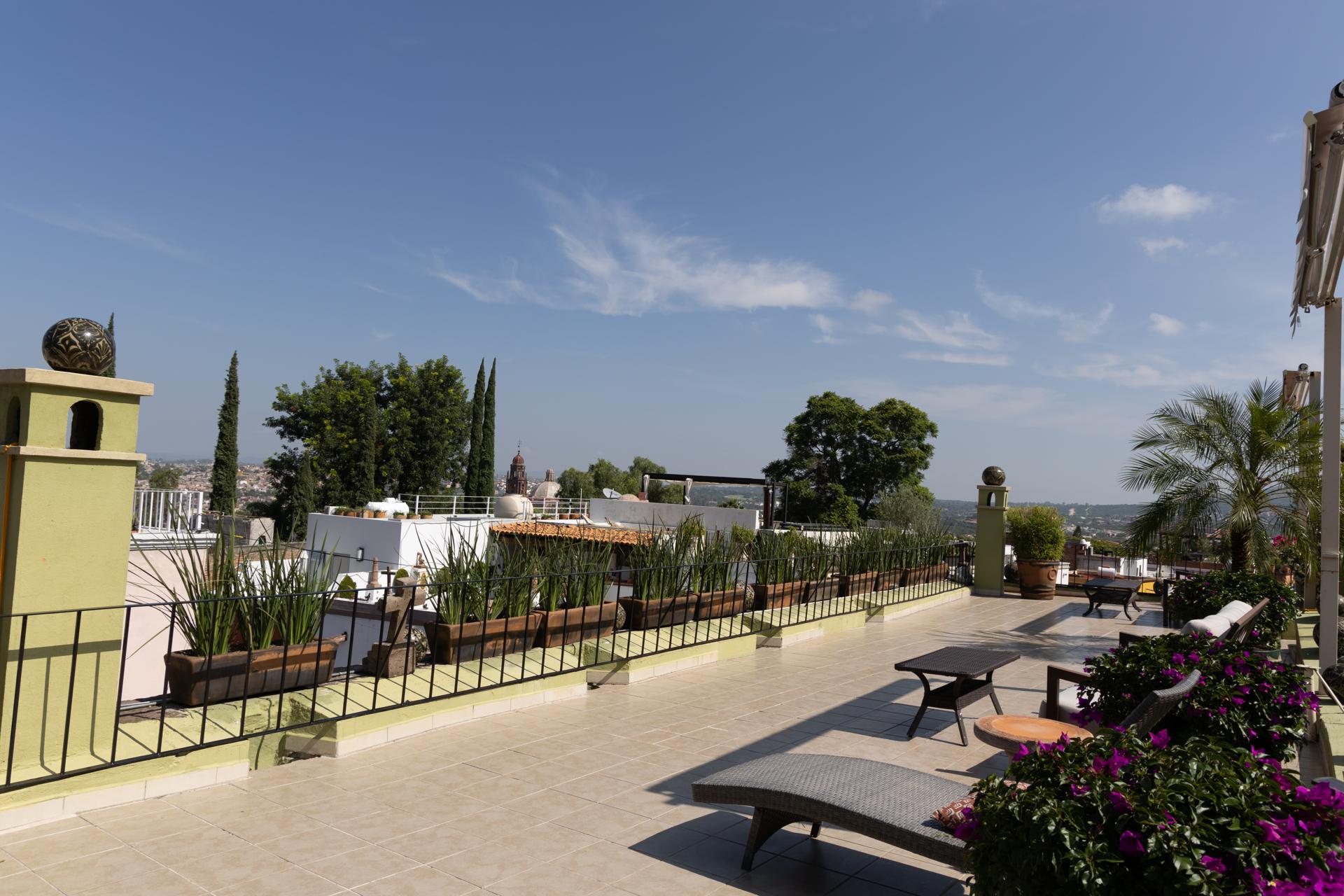 Casa Schuck at golden hour — the rooftop beneath the Parroquia, the whole house exclusively yours